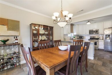 Charming dining room opens to kitchen for entertai