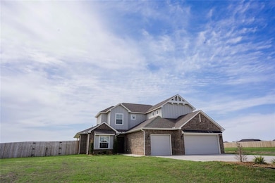 Craftsman house featuring a gate, a garage, fence,