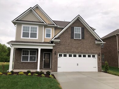 All brick, 2 car garage, covered porch, keyless entry lock, Ring doorbell, sod to back corners of home