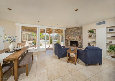 Formal Dining Room with Stacked Stone Fi