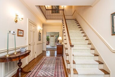 Front door w/transoms & side panels let light in