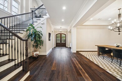 Vast entry opens up to the formal dining room and
