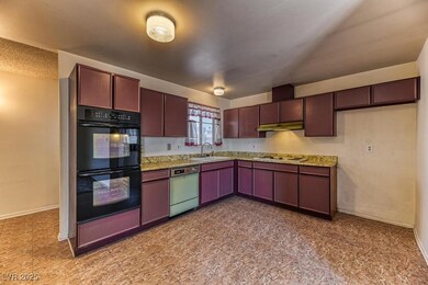 Kitchen featuring dobule oven black, dishwasher, b