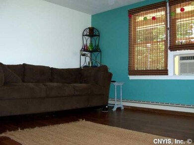 Living Room. Living room area with pergo floors could be used as formal dining room.