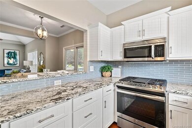 Kitchen overlooks dining area and great room!