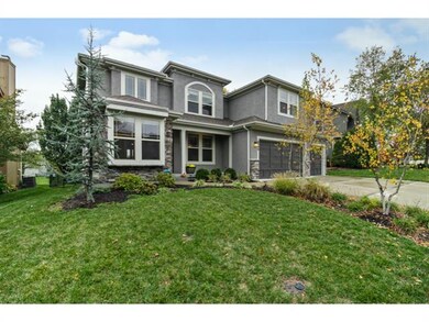 Welcoming home with beautiful landscaping.
