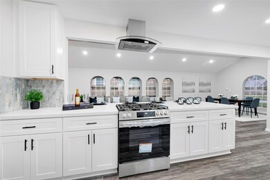 This photo showcases a modern, open-concept kitche