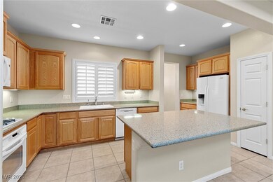 Kitchen featuring recessed lighting, white applian