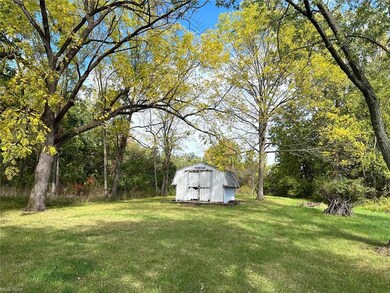 View of yard with a storage shed
