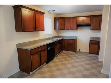 Beautiful cabinets in this spacious kitchen with p