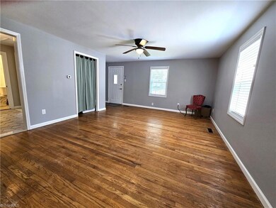 Living room looking toward front entry. Many rooms freshly painted.