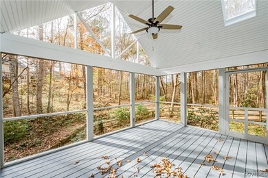 Sunroom featuring a healthy amount of sunlight, lo