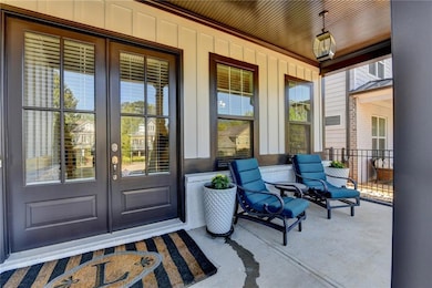 Property entrance featuring board and batten sidin