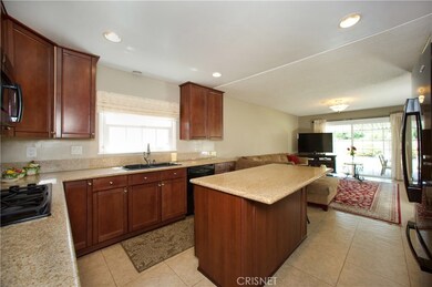 Chef's kitchen, custom cabinets, center island with breakfast bar, granite counters, pantry & recessed lights