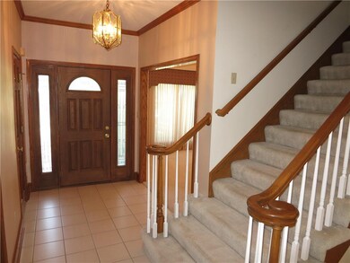 Tiled entryway. Formal dining room to left. Lots o
