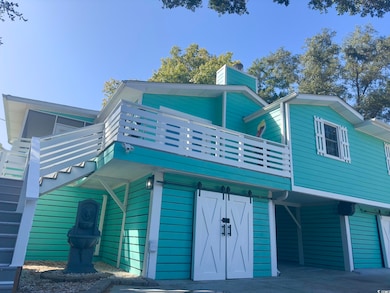 View of front of property featuring a balcony