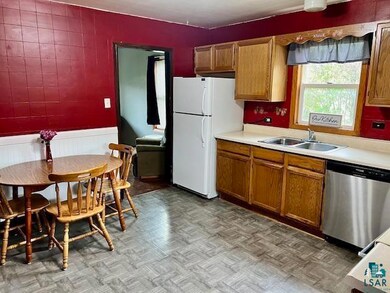 Kitchen with sink, parquet flooring, stainless ste
