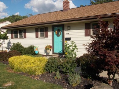 Wonderful curb appeal and lovely manicured yard.