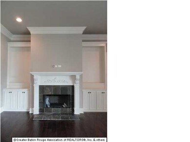 Living Room fireplace with side built in shelving 