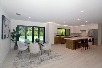 View of beautifully staged Dining and Kitchen