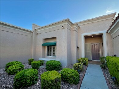 Entrance to property with stucco siding