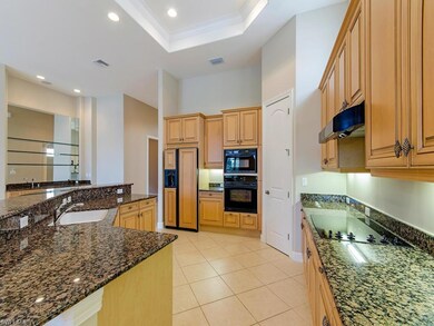 Custom cabinetry and granite counters in kitchen.