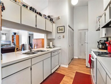 Well equipped kitchen galley with washer and dryer