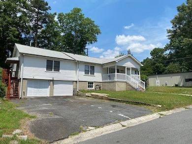 View of front of house with a front lawn, a porch,