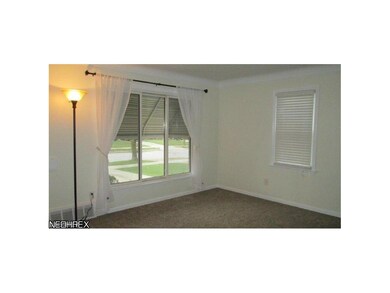 Living Room with new carpeting and wood blinds