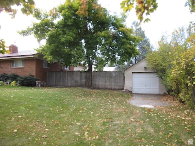 View of yard with a garage