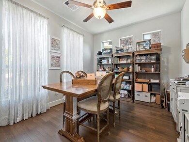 Large office with plenty of space for multiple work or craft stations.