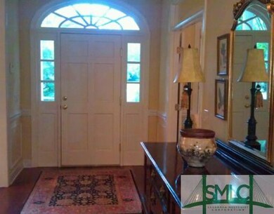 Foyer. Foyer with handsome entrance door, hardwood
