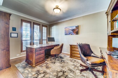 Study Room with wood flooring and crown molding