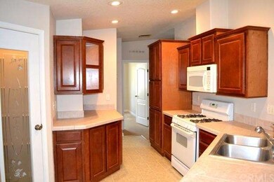 Isn't this kitchen beautiful.  Pantry on left. Gas