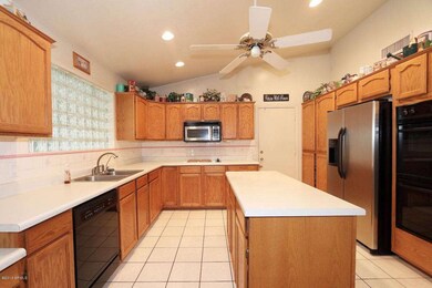 Kitchen island, side-by-side fridge