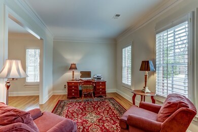 Formal living room/study with extensive crown mold
