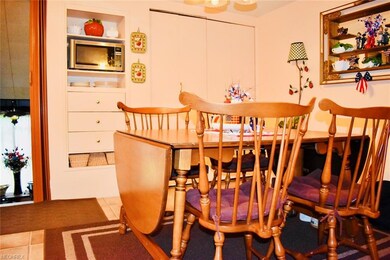 The eat-in kitchen has extra shelving and storage 