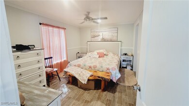 Master Bedroom with vinyl wood looking floor and c