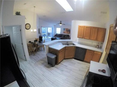 Sky light and high ceilings make the kitchen brigh