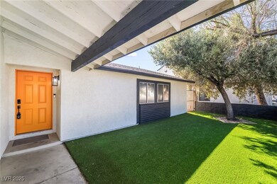 View of exterior entry with stucco siding