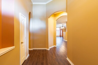 Entry looking into formal dining and family room.