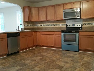Another view of kitchen - open to family room