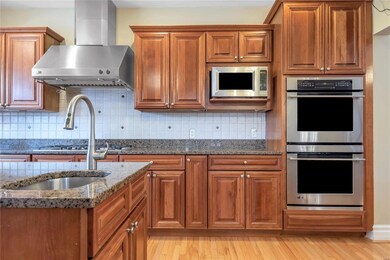 Stainless appliances include range hood, microwave