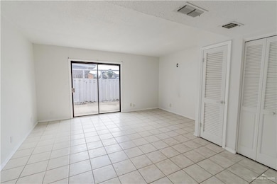Living room and view of patio.