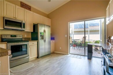 Large open kitchen with sliders leading out to the