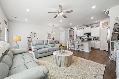 Living room with dark hardwood / wood-style floori