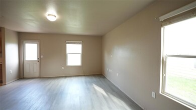 Empty room featuring light wood finished floors a