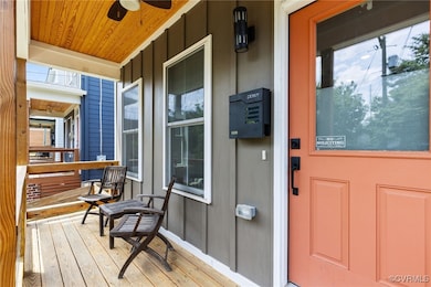 A modern styled covered front porch with overhead