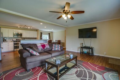 View of great room, kitchen & dining area.