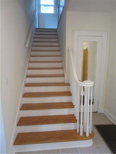 View from front door, beautiful wood staircase